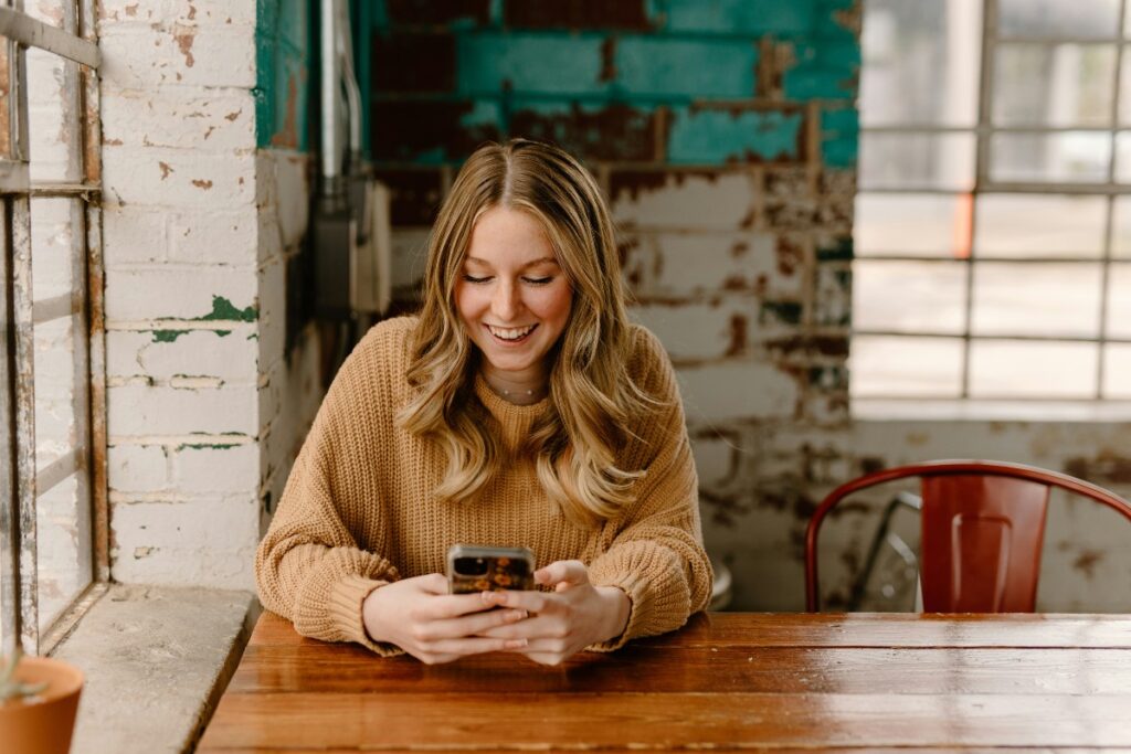 The Case for Sustained Borrower Support Beyond the Lending Decision Borrower checking a loan account on a smartphone: The Case for Sustained Borrower Support Beyond the Lending Decision