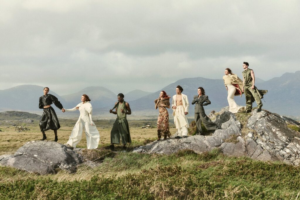 Coming Home Campaign Brings Film, Music, Fashion And Sport Stars To Ireland Fashion Week: the Ireland Fashion Week 2026 Coming Home campaign cast on the rocks at Roundstone, Connemara, photographed by Damian Foxe